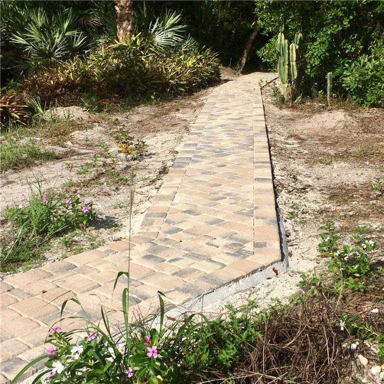 9605 Riverview Drive Micco, FL 32976 - Photo 29 of 36 a view of empty space with wooden fence