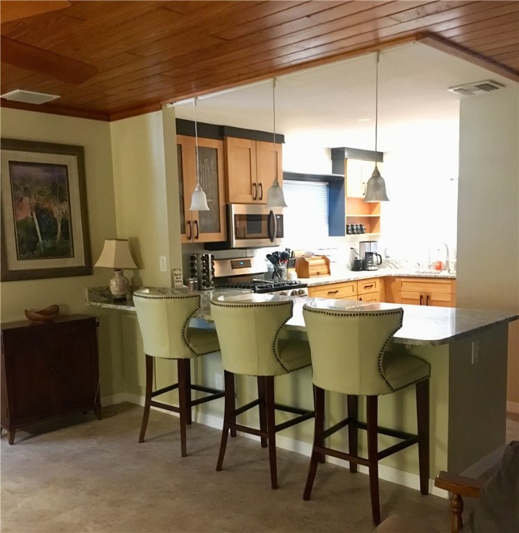 9605 Riverview Drive Micco, FL 32976 - Photo 10 of 36 a room with a table chairs and a kitchen view