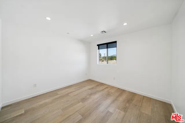 an empty room with a empty space and a window