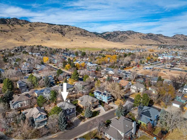 an aerial view of residential houses with outdoor space