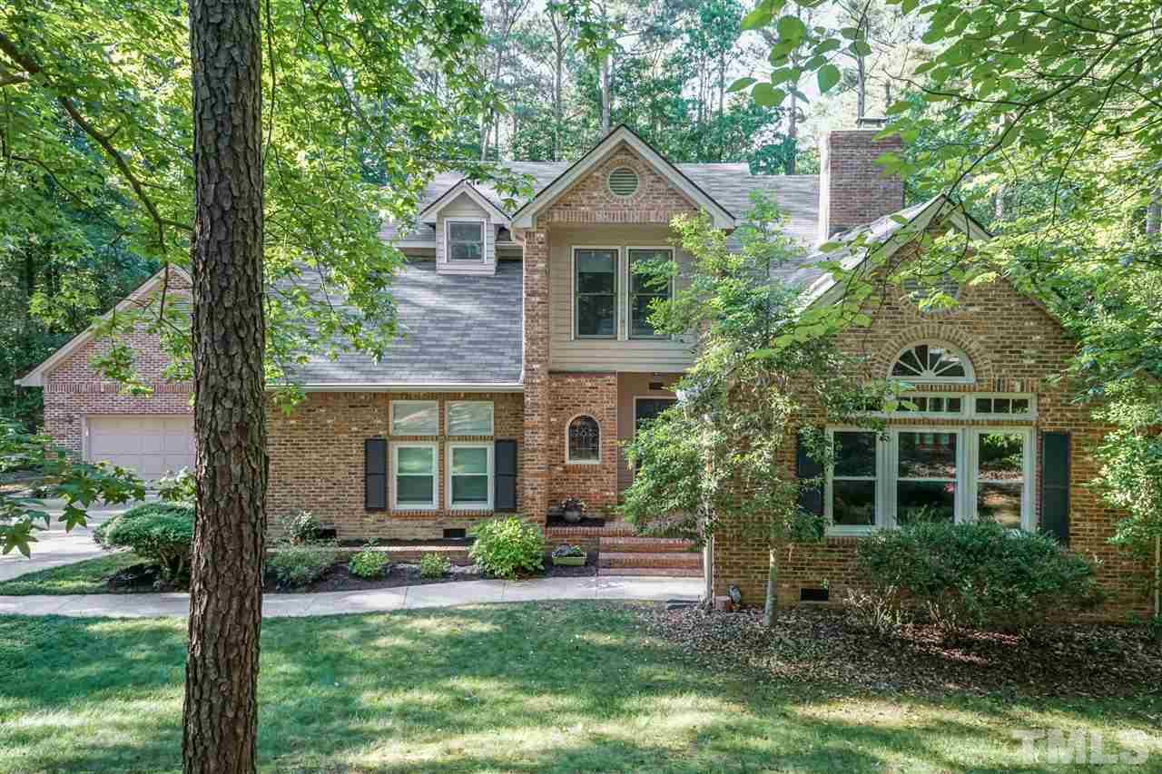 712 Misty Isle Place Raleigh, NC 27615 - Photo 1 of 30 a front view of a house with garden