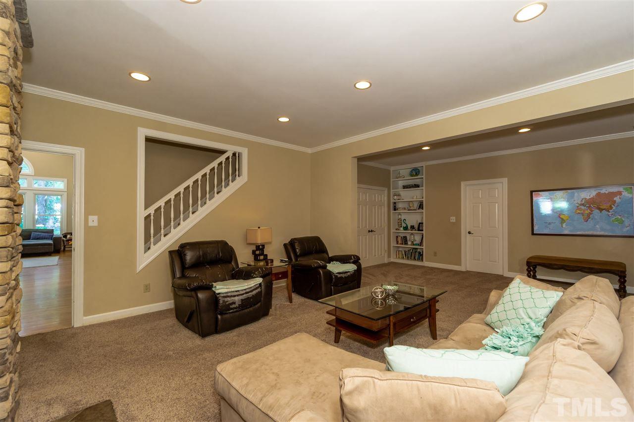 712 Misty Isle Place Raleigh, NC 27615 - Photo 11 of 30 a living room with furniture and a couch