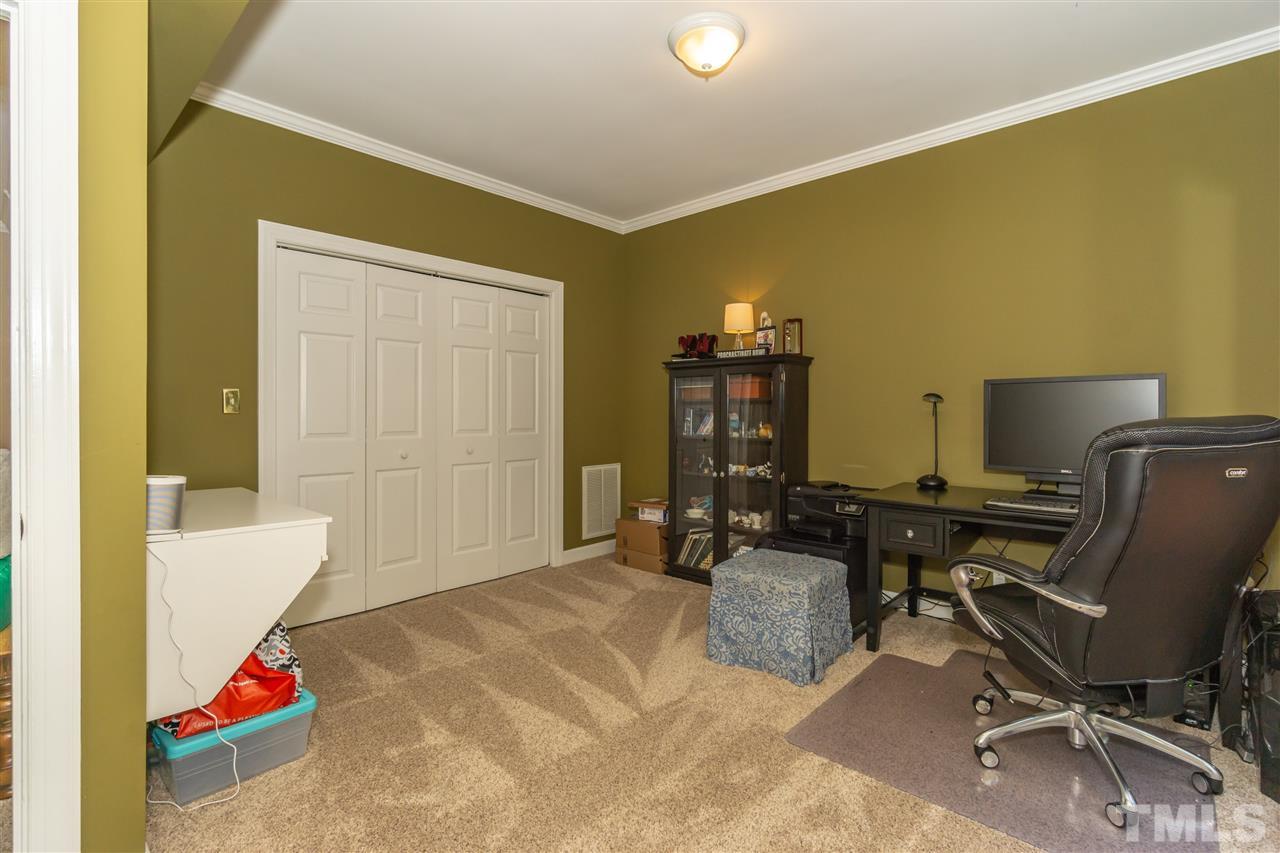 712 Misty Isle Place Raleigh, NC 27615 - Photo 15 of 30 a workspace with furniture and a gate