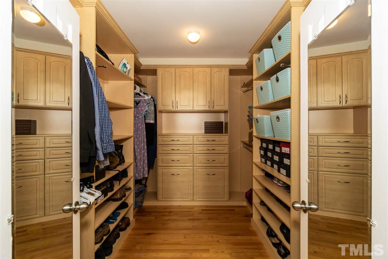 712 Misty Isle Place Raleigh, NC 27615 - Photo 21 of 30 a view of walk in closet with clothes
