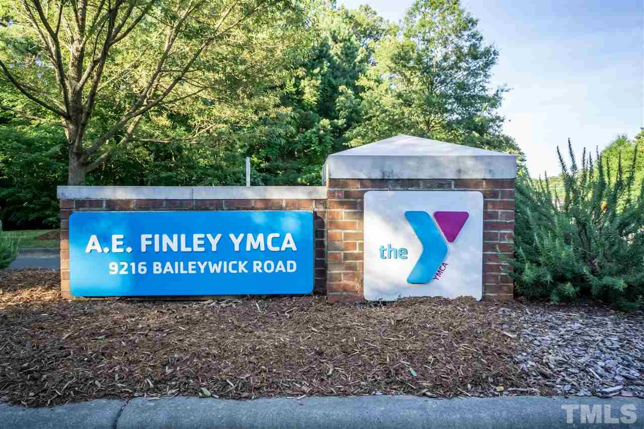 712 Misty Isle Place Raleigh, NC 27615 - Photo 29 of 30 a sign that is sitting on a wooden bench