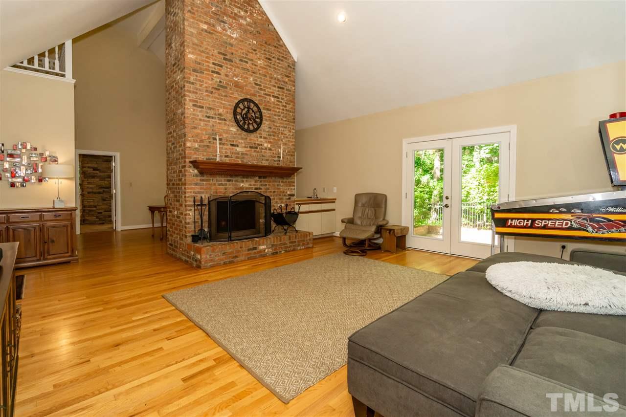 712 Misty Isle Place Raleigh, NC 27615 - Photo 4 of 30 a living room with furniture and a fireplace