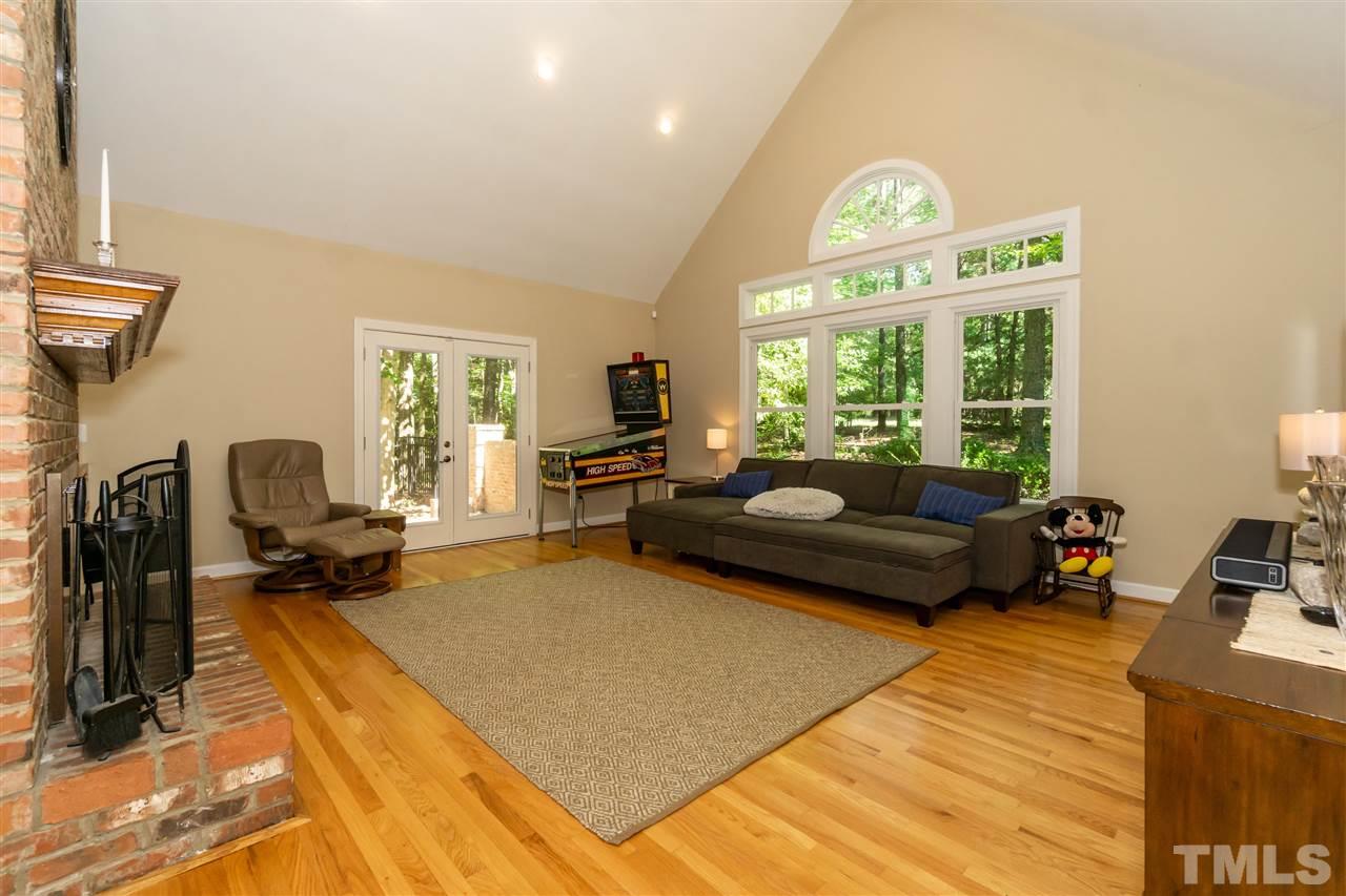 712 Misty Isle Place Raleigh, NC 27615 - Photo 5 of 30 a living room with furniture and a large window