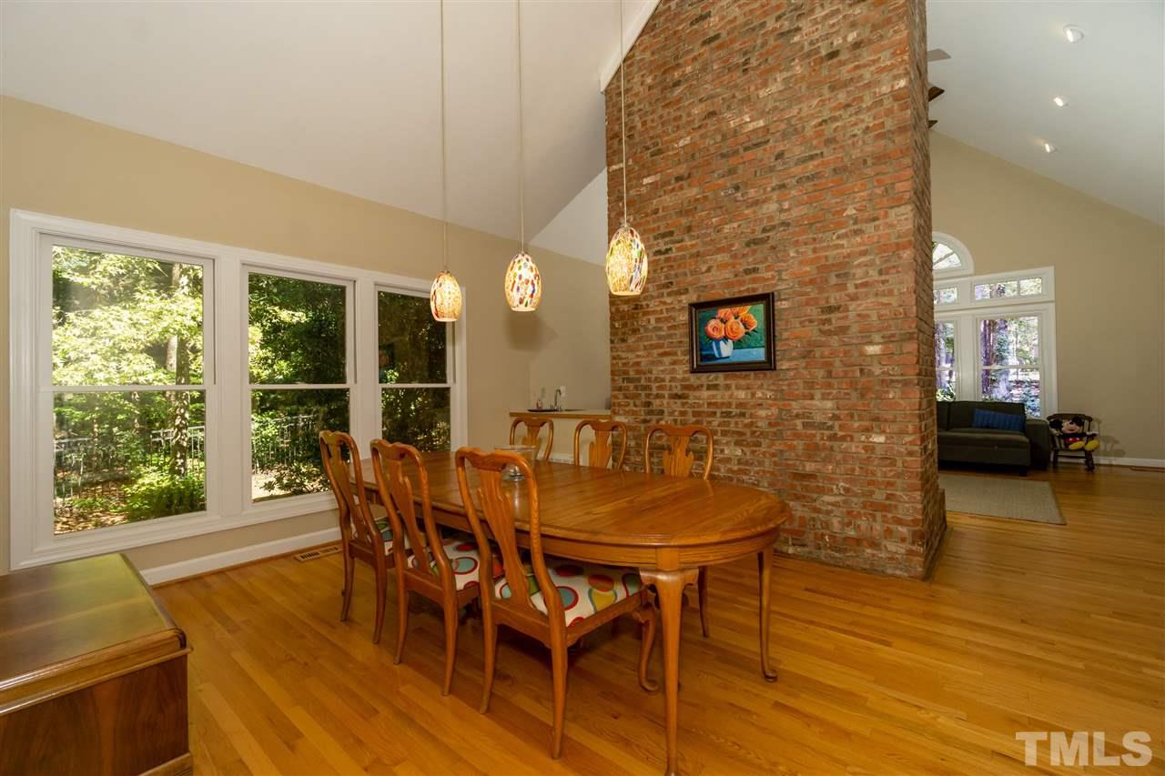712 Misty Isle Place Raleigh, NC 27615 - Photo 6 of 30 a dining room with furniture and wooden floor