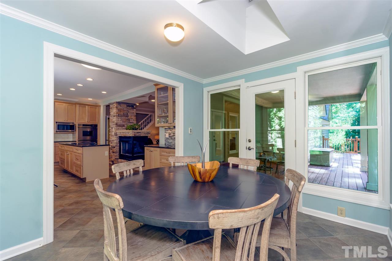 712 Misty Isle Place Raleigh, NC 27615 - Photo 10 of 30 a view of a dining room with furniture window and outside view