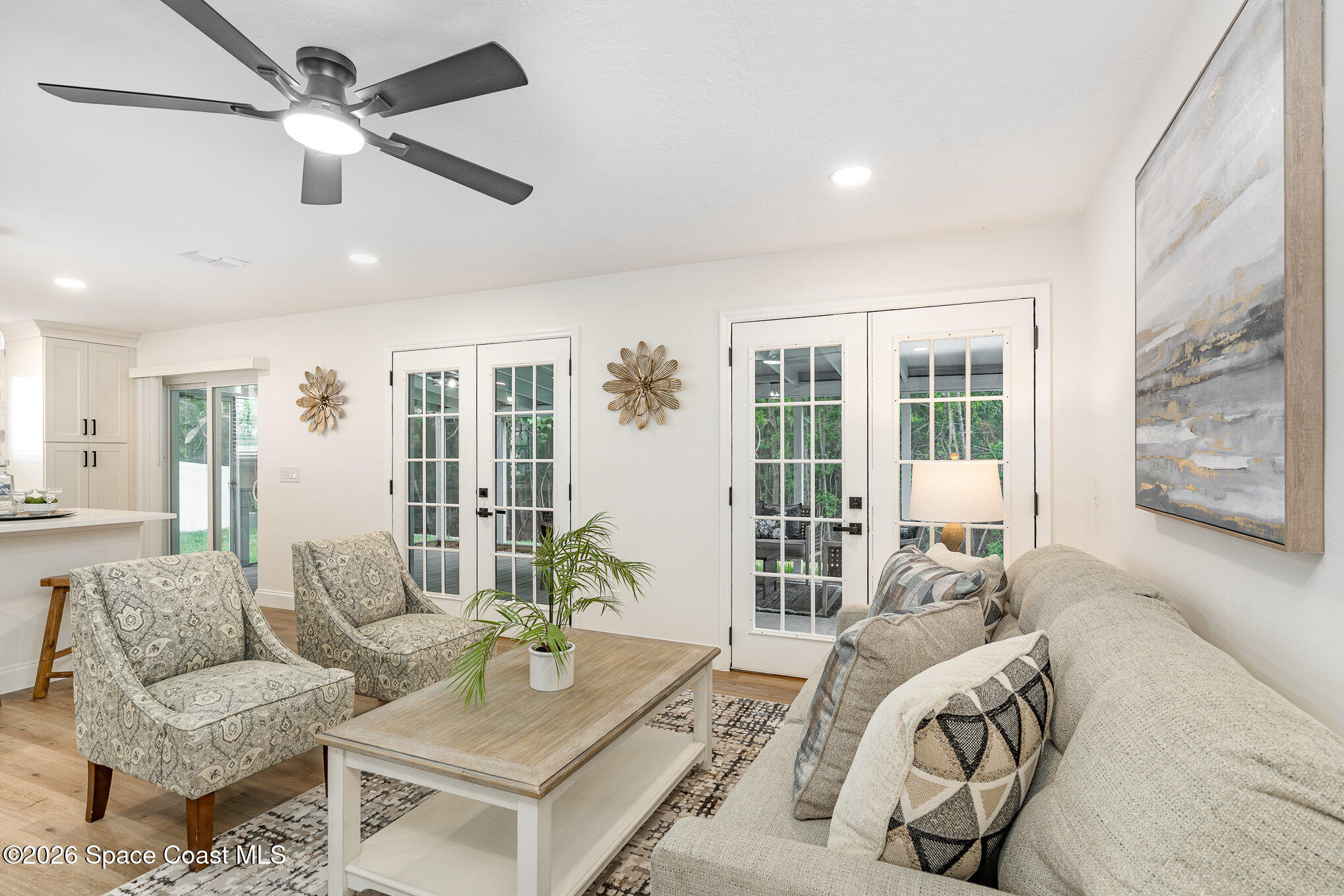 362 Nikomas Way Melbourne Beach, FL 32951 - Photo 5 of 32 a living room with furniture and a large window