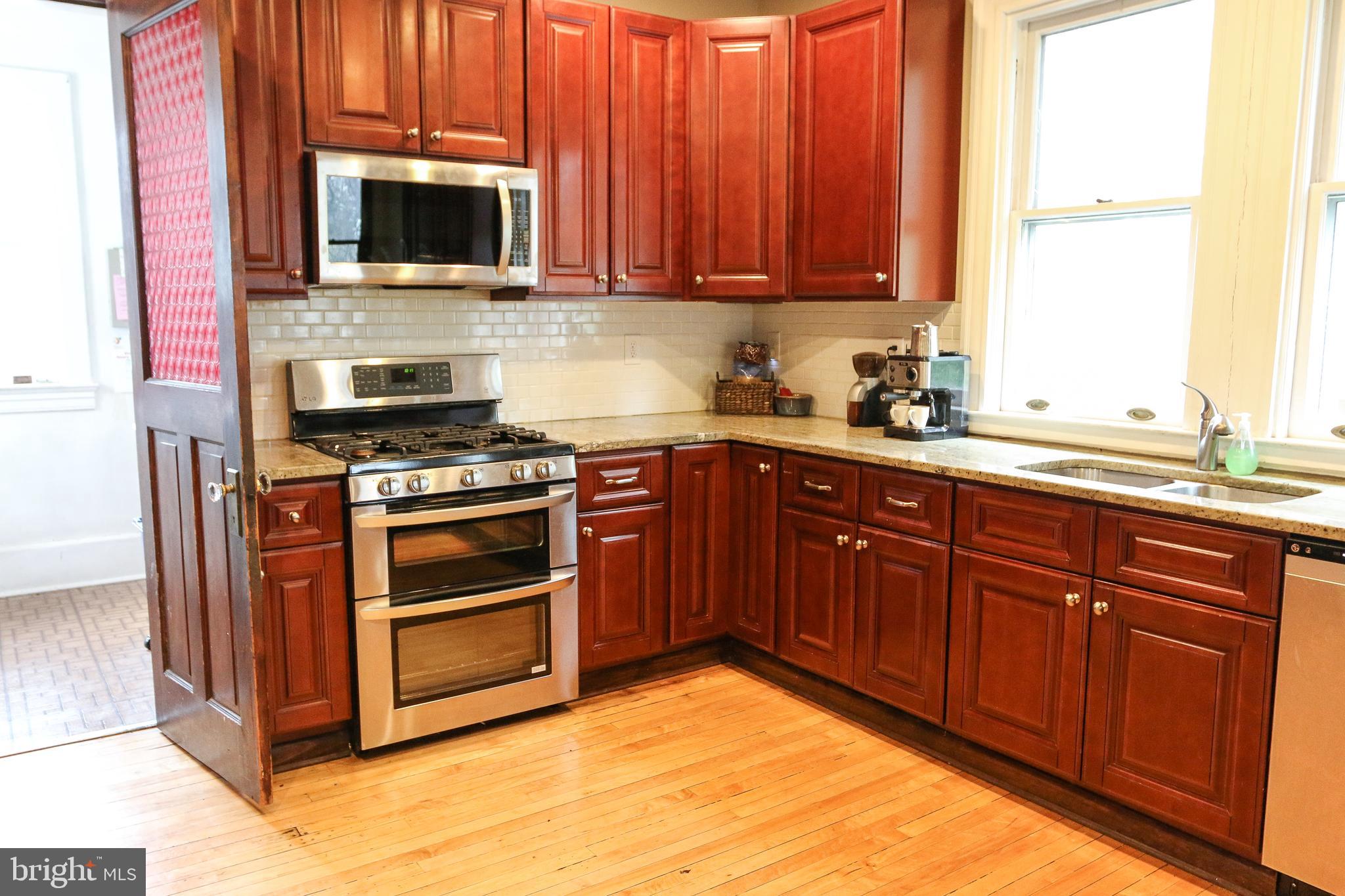 40 North Rolling Road Baltimore, MD 21228 - Photo 7 of 52 Kitchen with door into 1st Floor Laundry room
