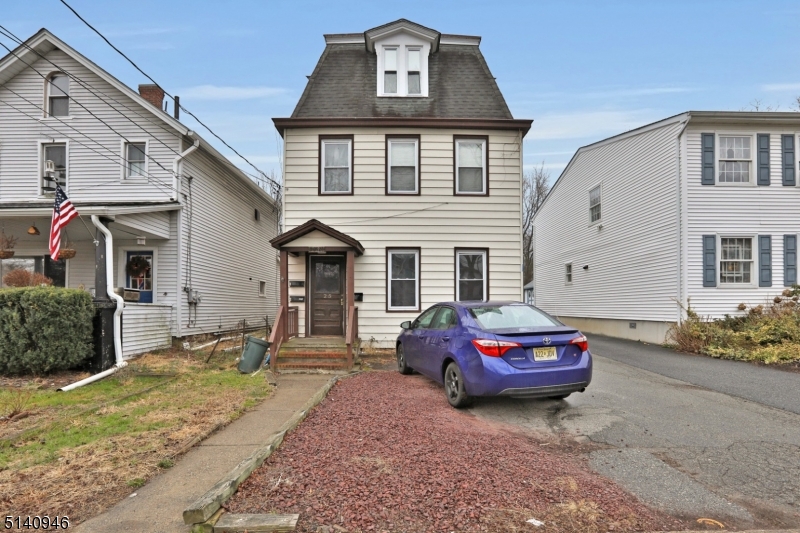 25 Kiel Avenue, Unit 1 Butler, NJ 07405 - Photo 2 of 13 a car parked in front of a house