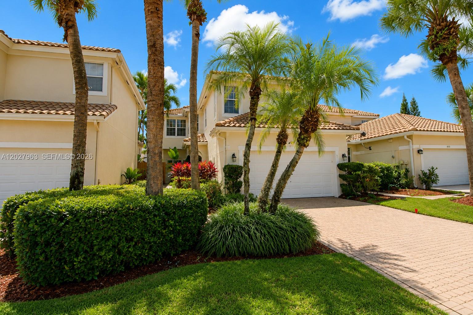 6646 Northwest 25th Terrace Boca Raton, FL 33496 - Photo 41 of 48 a view of a house with a yard and potted plants