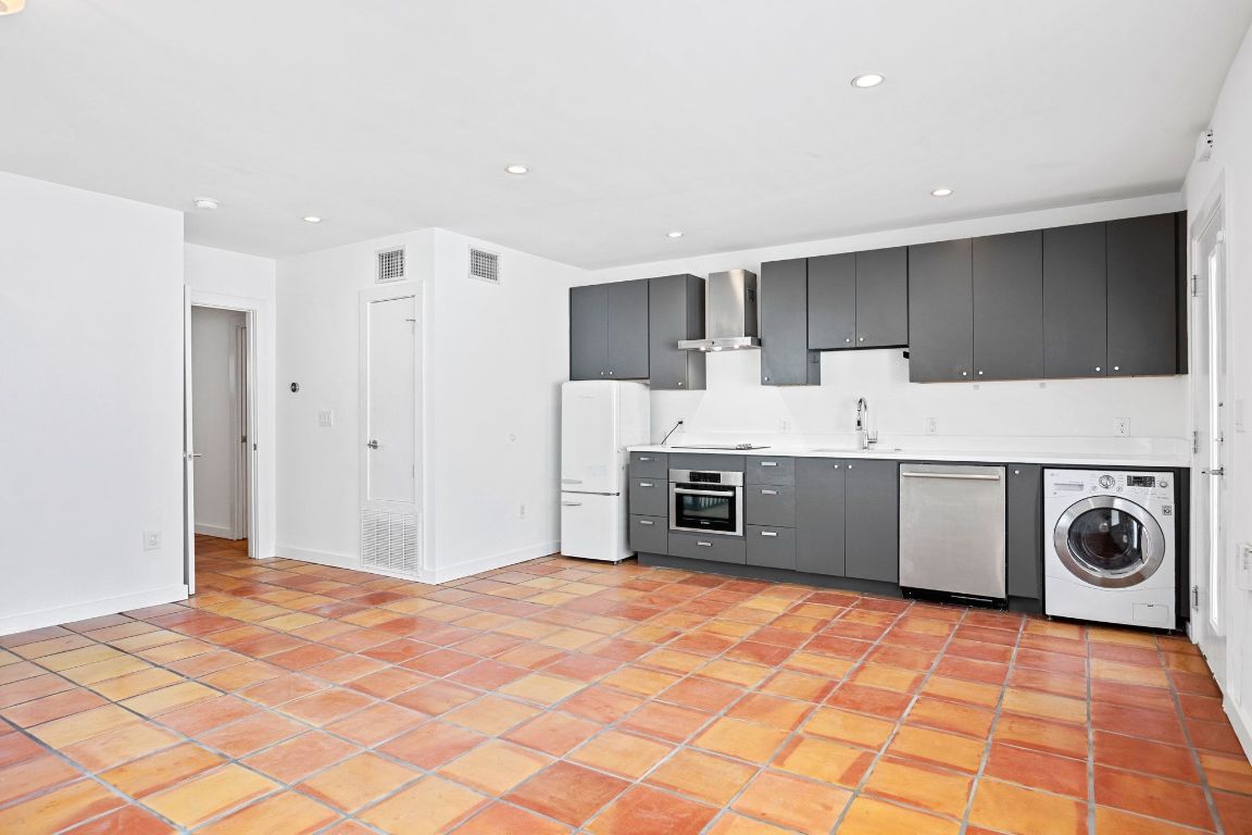 a utility room with washer and dryer