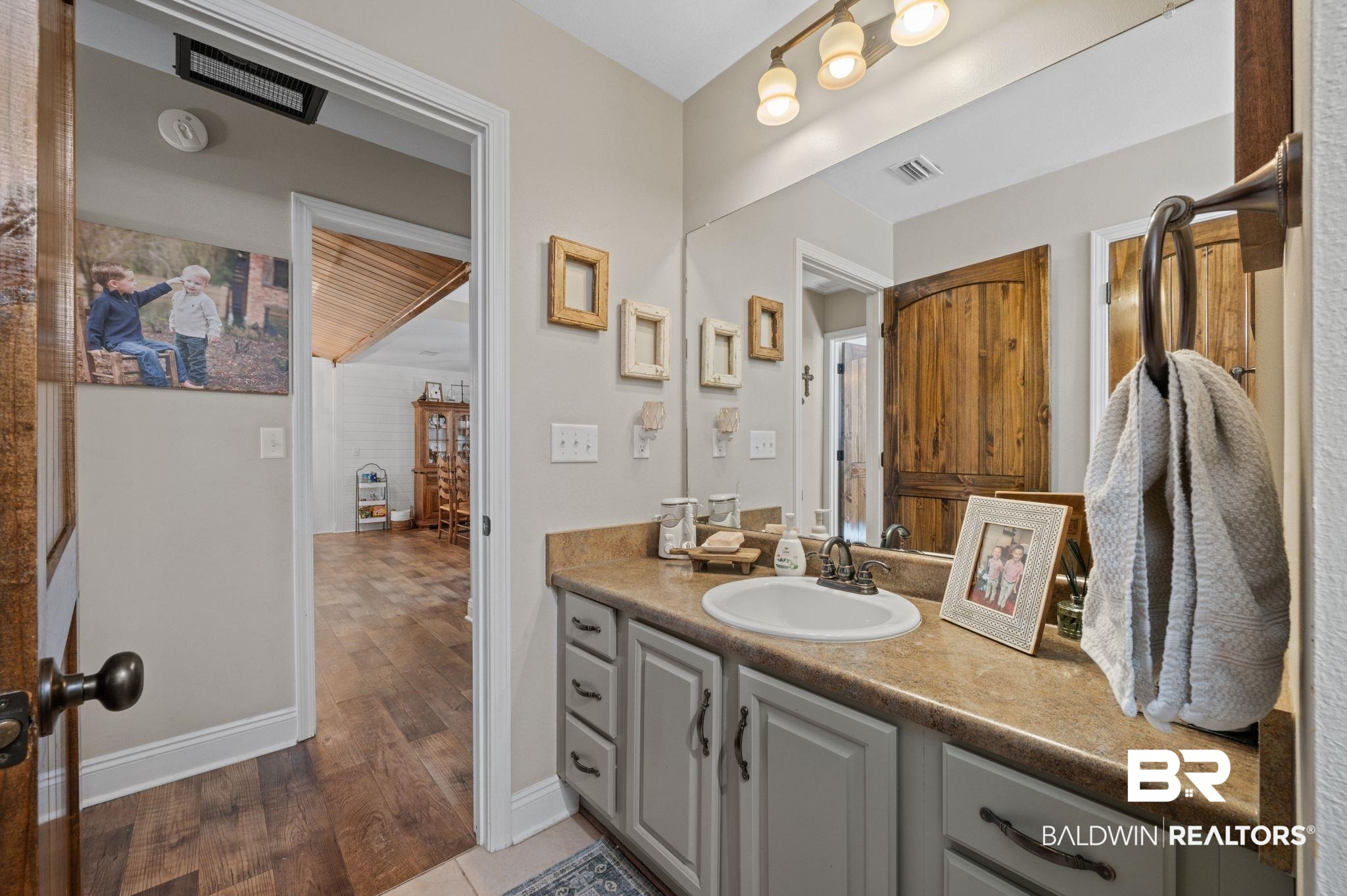 38211-d) V R Byrd Road Bay Minette, AL 36507 - Photo 24 of 58 Bathroom featuring vanity and hardwood / wood-style flooring