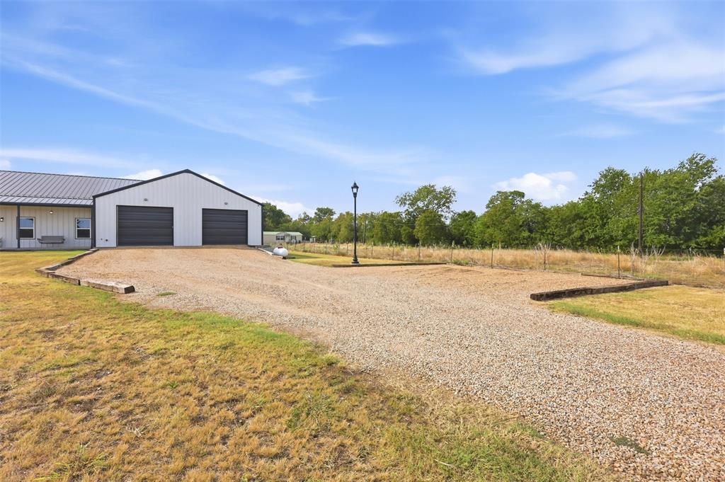 208 Chicken Field Road Whitewright, TX 75491 - Photo 4 of 40 Long driveway, plenty of parking space