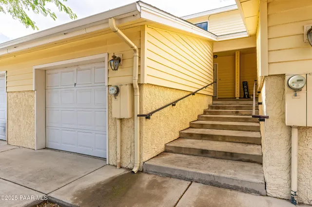 a view of a house with wooden walls