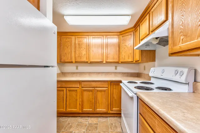 a spacious bedroom with a bed and a window