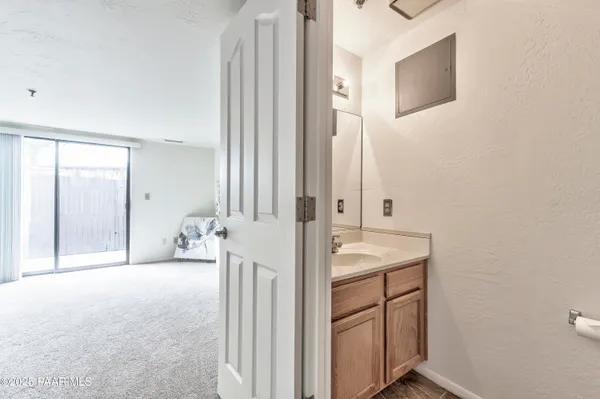 a view of a bathroom with mirror