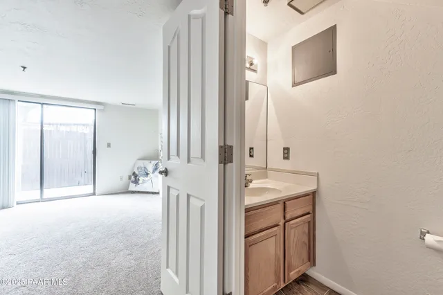 a view of a bathroom with mirror