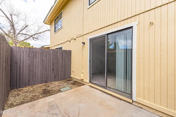 a view of a kitchen with an empty space and a window