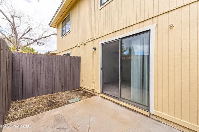 a view of a kitchen with an empty space and a window