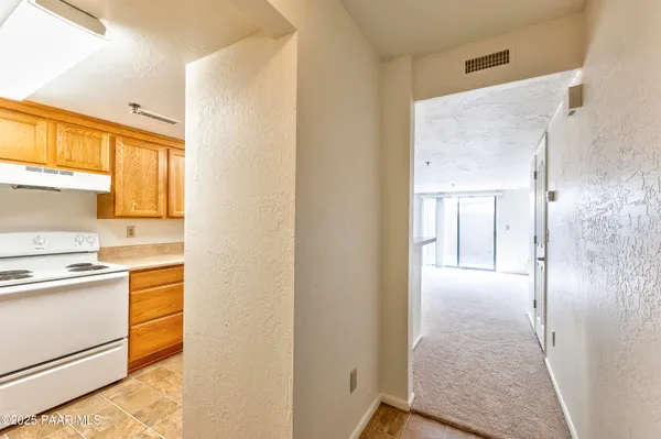 a kitchen with a stove a sink and a microwave