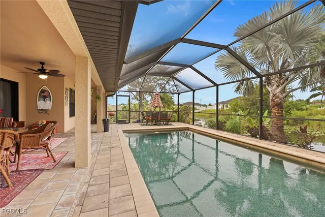 a view of a swimming pool with a patio