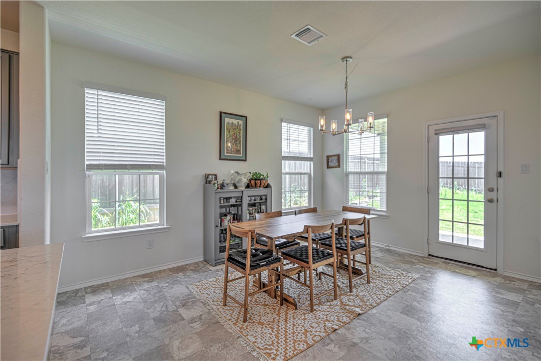 119 Lucky Texan Cove Jarrell, TX 76537 - Photo 11 of 33 a view of a dining room with furniture and window