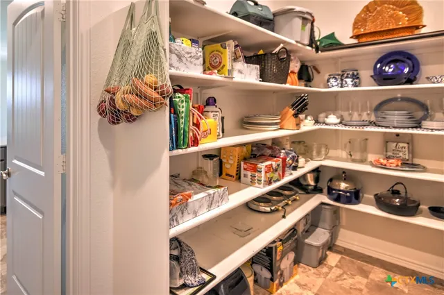 a shelf with books and knick knacks on it