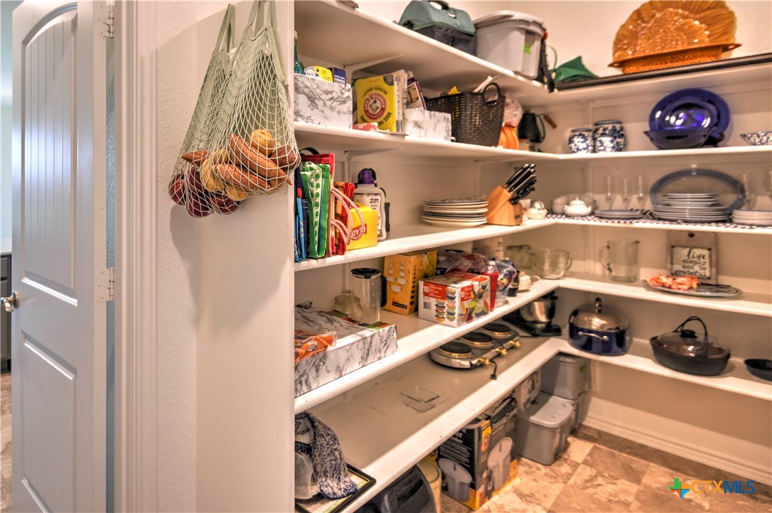 119 Lucky Texan Cove Jarrell, TX 76537 - Photo 18 of 33 a shelf with books and knick knacks on it