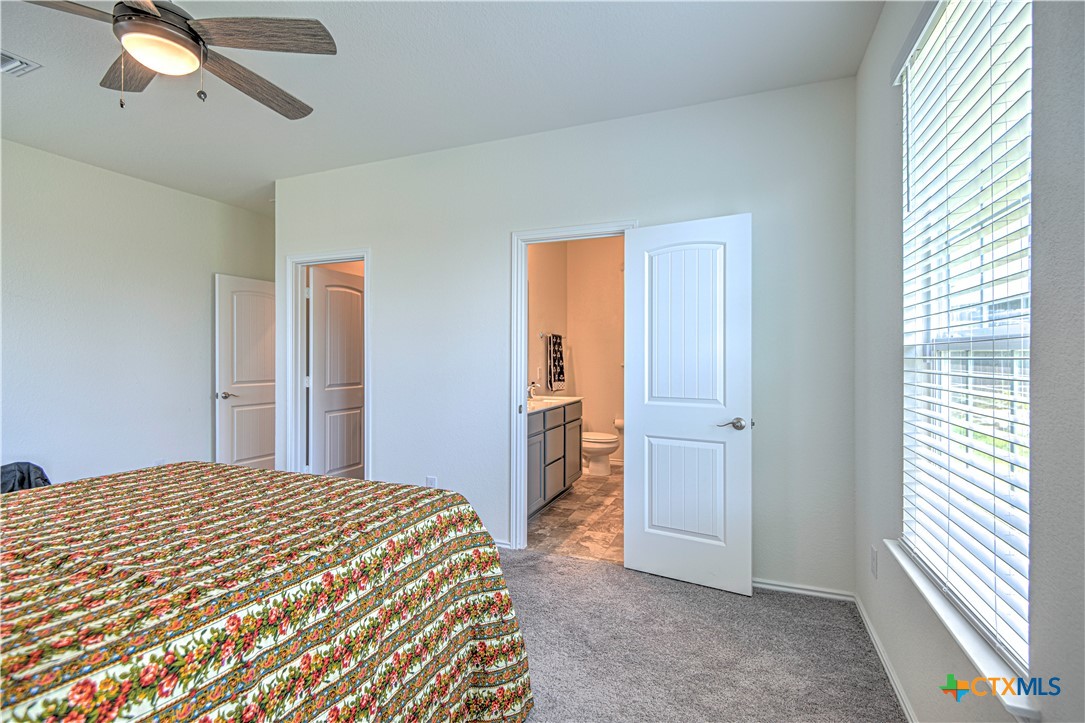119 Lucky Texan Cove Jarrell, TX 76537 - Photo 21 of 33 a bedroom with a bed and a window