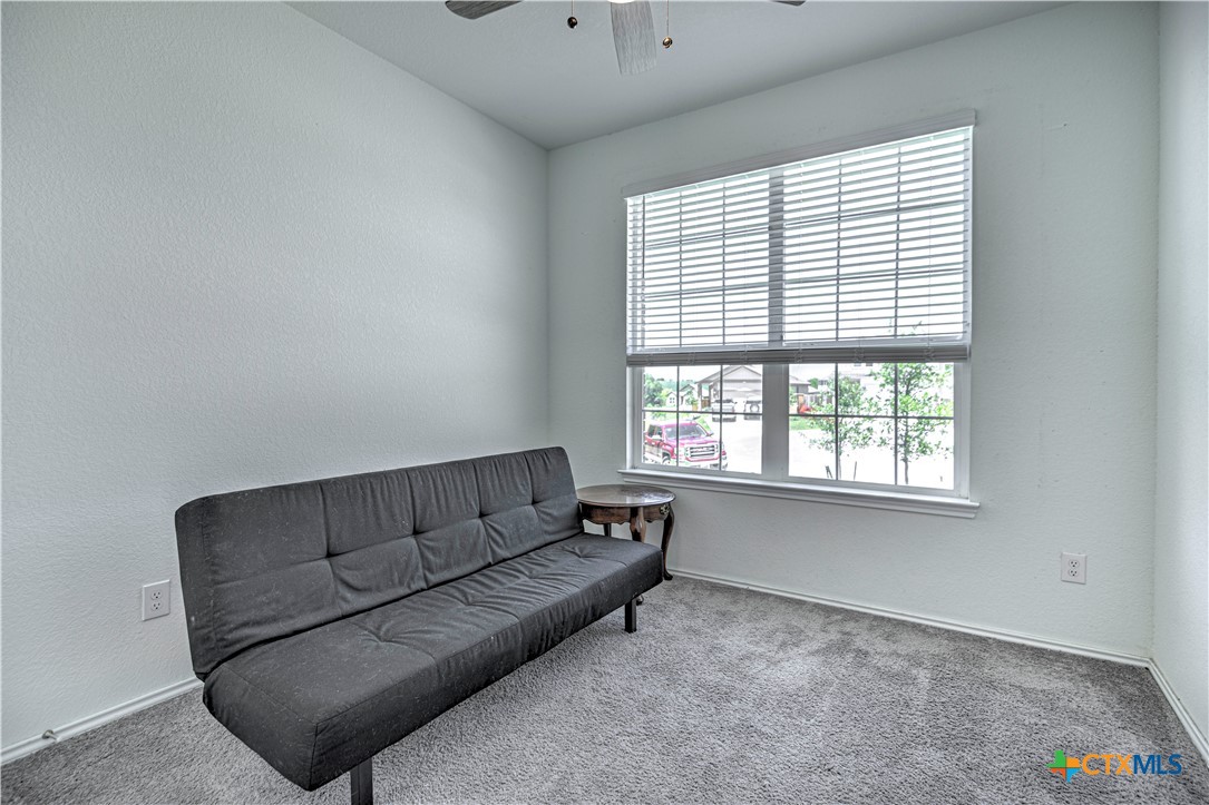 119 Lucky Texan Cove Jarrell, TX 76537 - Photo 24 of 33 a living room with furniture and a large window