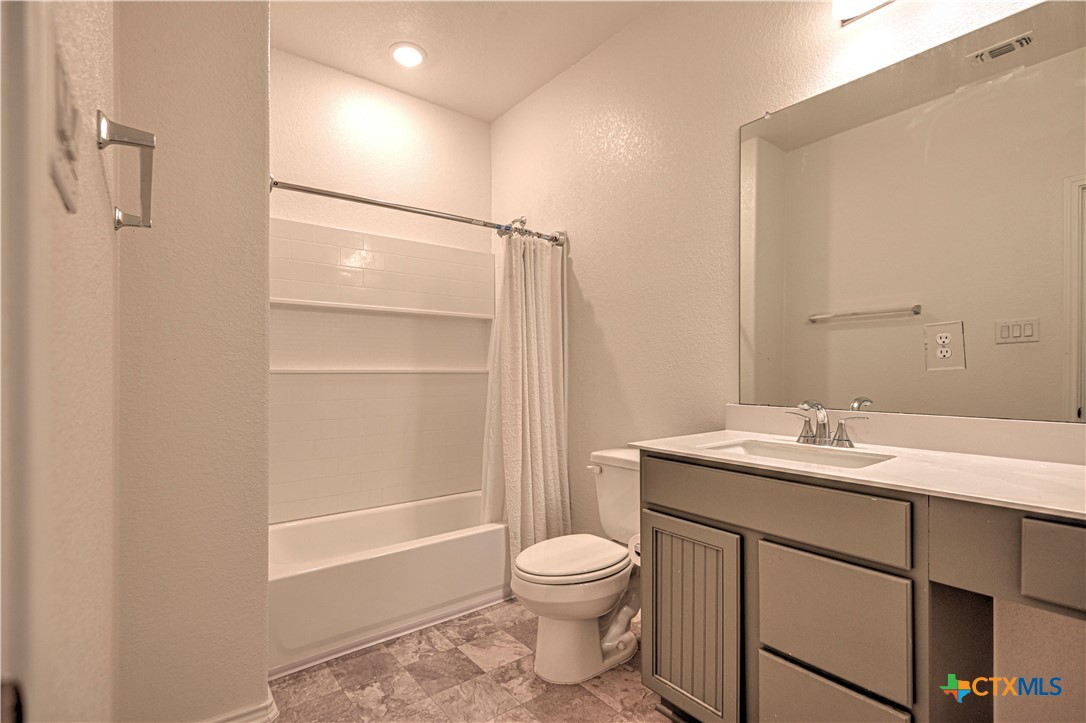 119 Lucky Texan Cove Jarrell, TX 76537 - Photo 27 of 33 a bathroom with a sink a toilet and shower