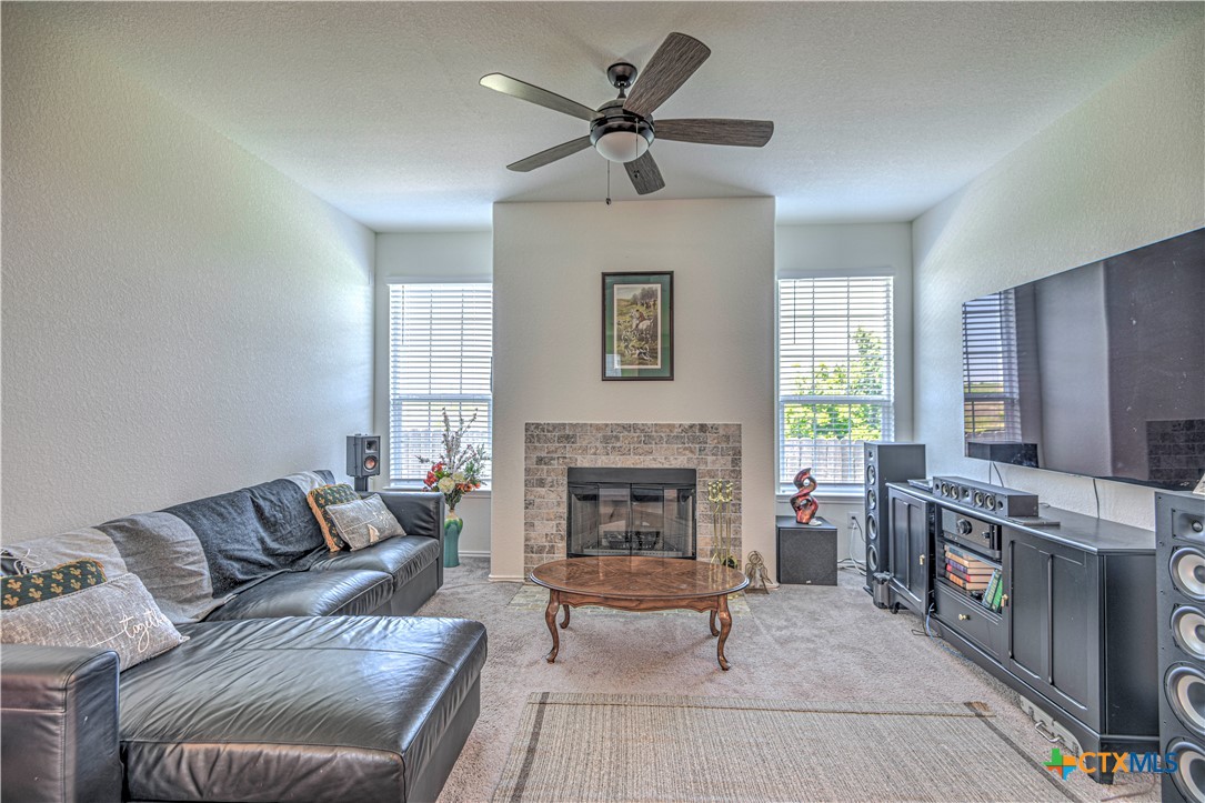 119 Lucky Texan Cove Jarrell, TX 76537 - Photo 9 of 33 a living room with furniture and a fireplace