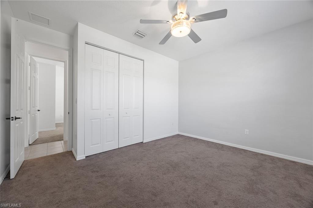 5538 Useppa Drive Ave Maria, FL 34142 - Photo 9 of 35 an empty room with a fan & a ceiling fan