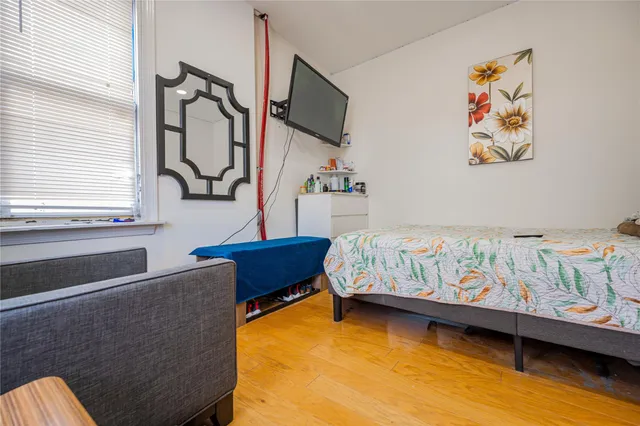 a bedroom with furniture and a window