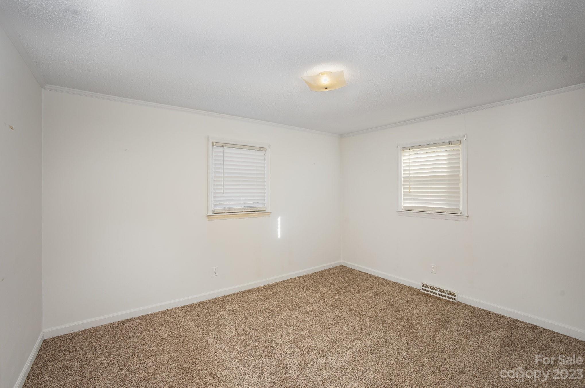 408 Jane Street Cherryville, NC 28021 - Photo 11 of 15 an empty room with windows