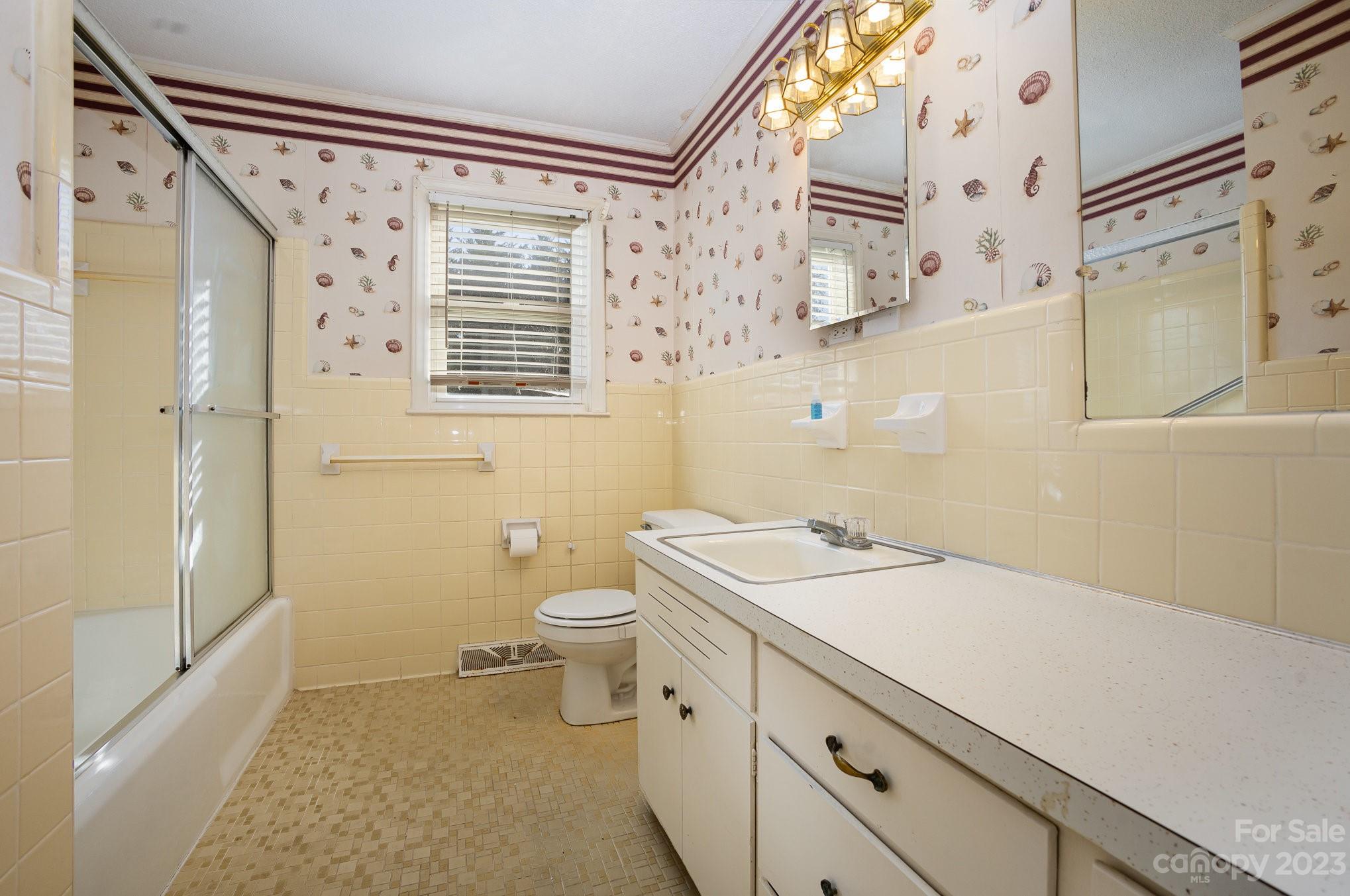 408 Jane Street Cherryville, NC 28021 - Photo 12 of 15 a bathroom with a sink a toilet and shower