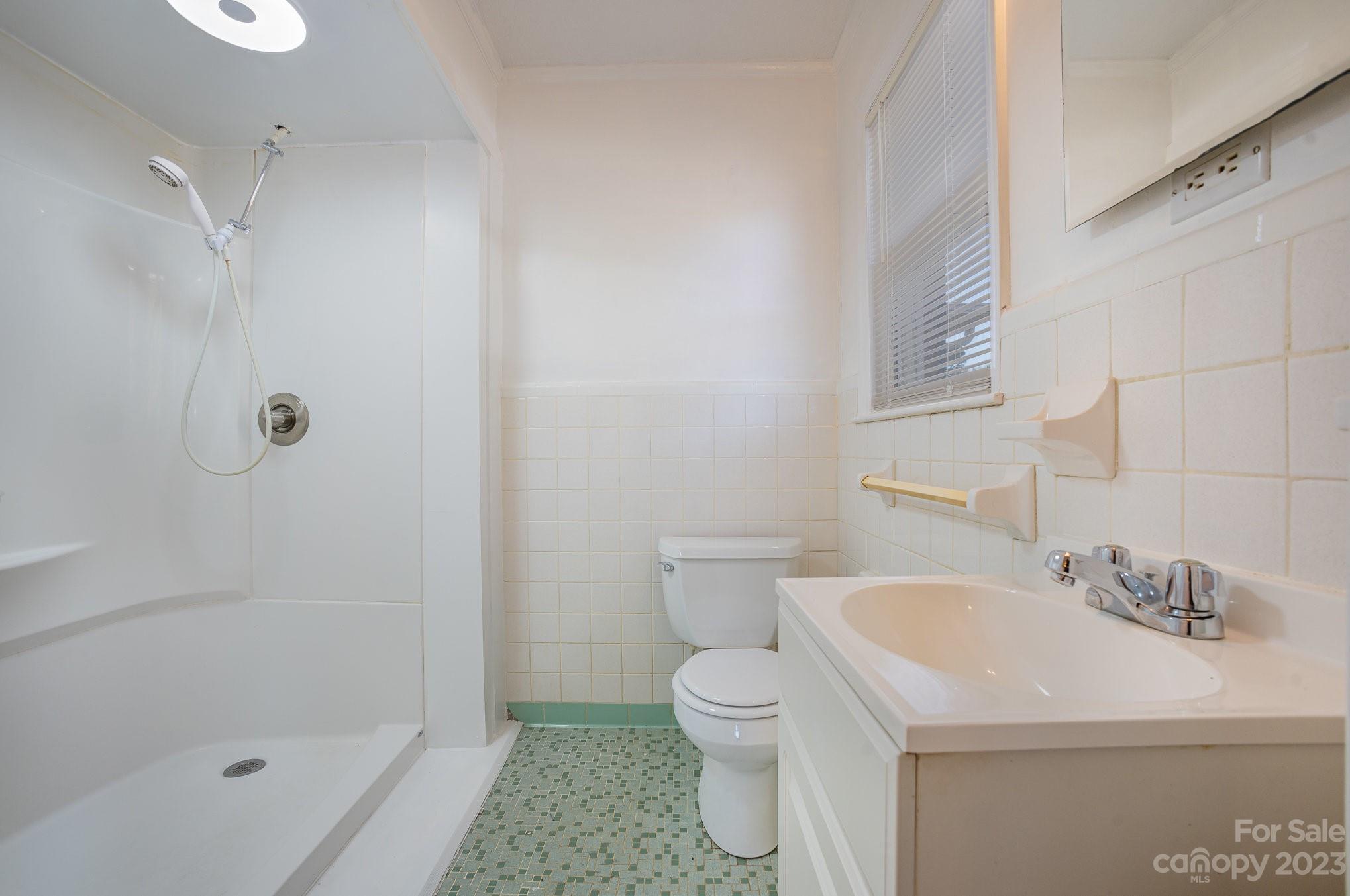408 Jane Street Cherryville, NC 28021 - Photo 9 of 15 a bathroom with a sink toilet and shower