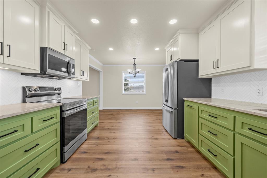 4401 Lacey Circle Waco, TX 76708 - Photo 14 of 38 a kitchen with stainless steel appliances granite countertop a refrigerator and a stove top oven