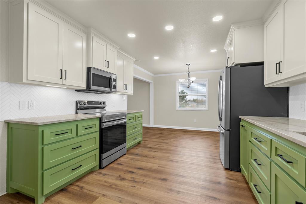 4401 Lacey Circle Waco, TX 76708 - Photo 15 of 38 a kitchen with stainless steel appliances granite countertop a refrigerator stove and sink