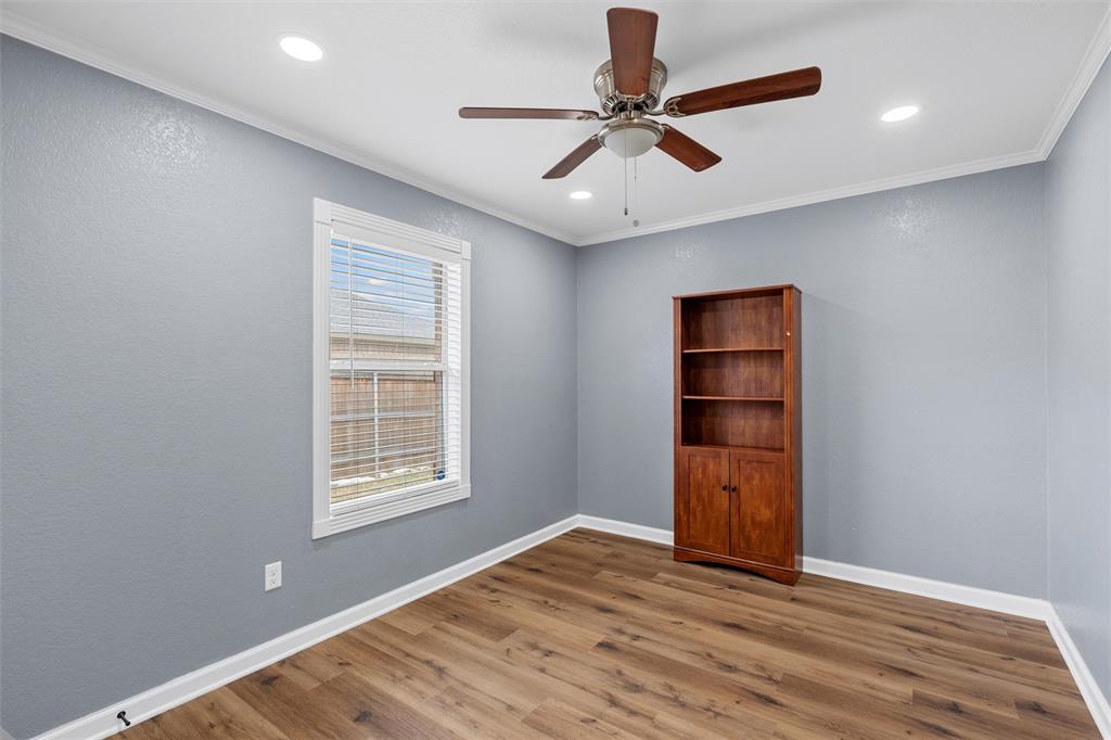 4401 Lacey Circle Waco, TX 76708 - Photo 21 of 38 a view of an empty room with a window and wooden floor