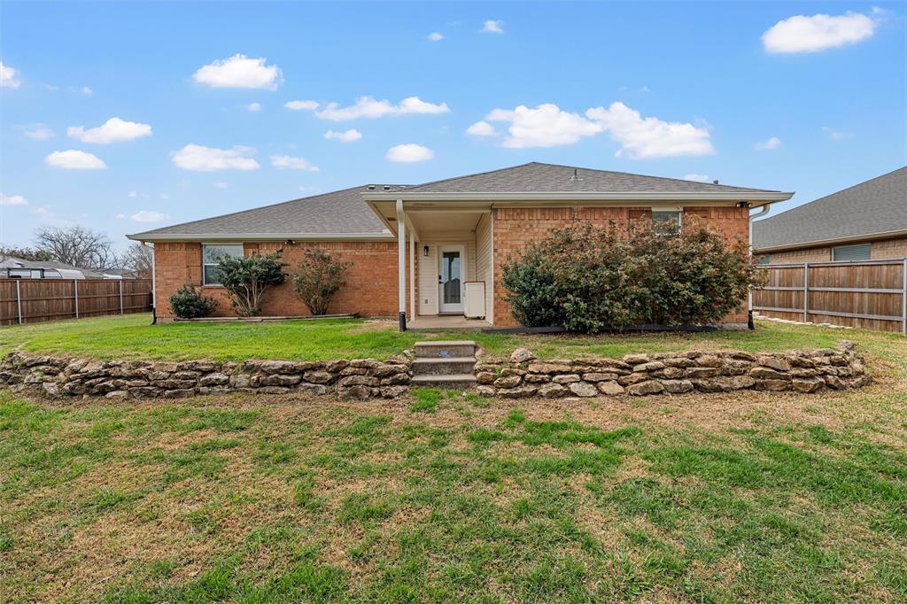 4401 Lacey Circle Waco, TX 76708 - Photo 36 of 38 a view of a house with a garden