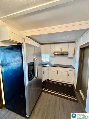 a bathroom with a toilet sink and shower