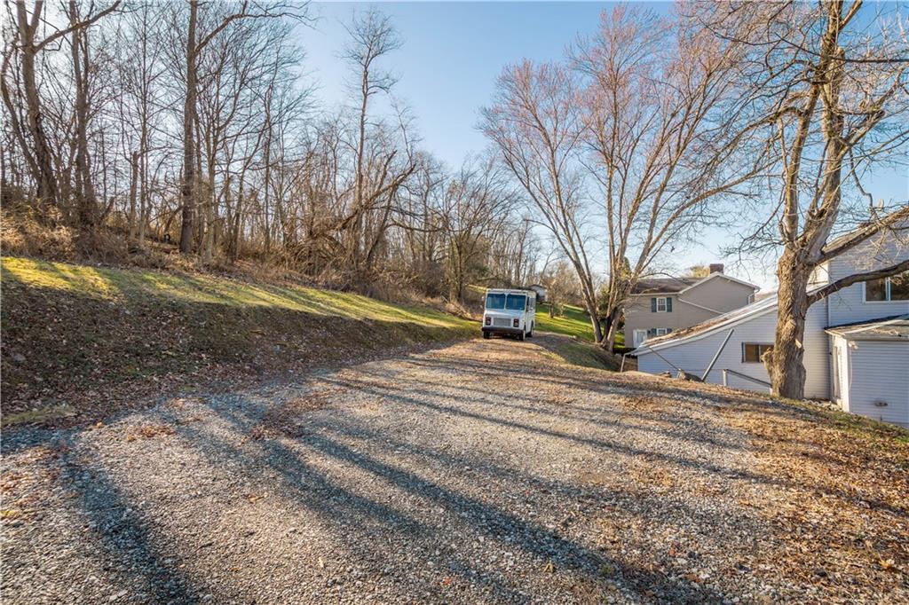 642 Seminary Avenue Oakdale, PA 15071 - Photo 6 of 15 a view of road with large trees