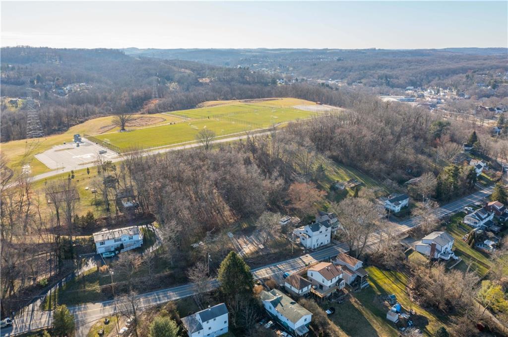 642 Seminary Avenue Oakdale, PA 15071 - Photo 10 of 15 an aerial view of residential houses with outdoor space and swimming pool