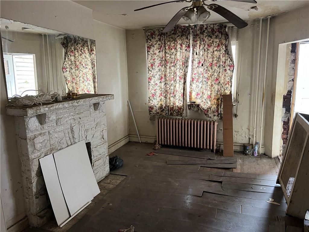 72 Harlem Avenue McKees Rocks, PA 15136 - Photo 6 of 6 an empty room with wooden floor and windows