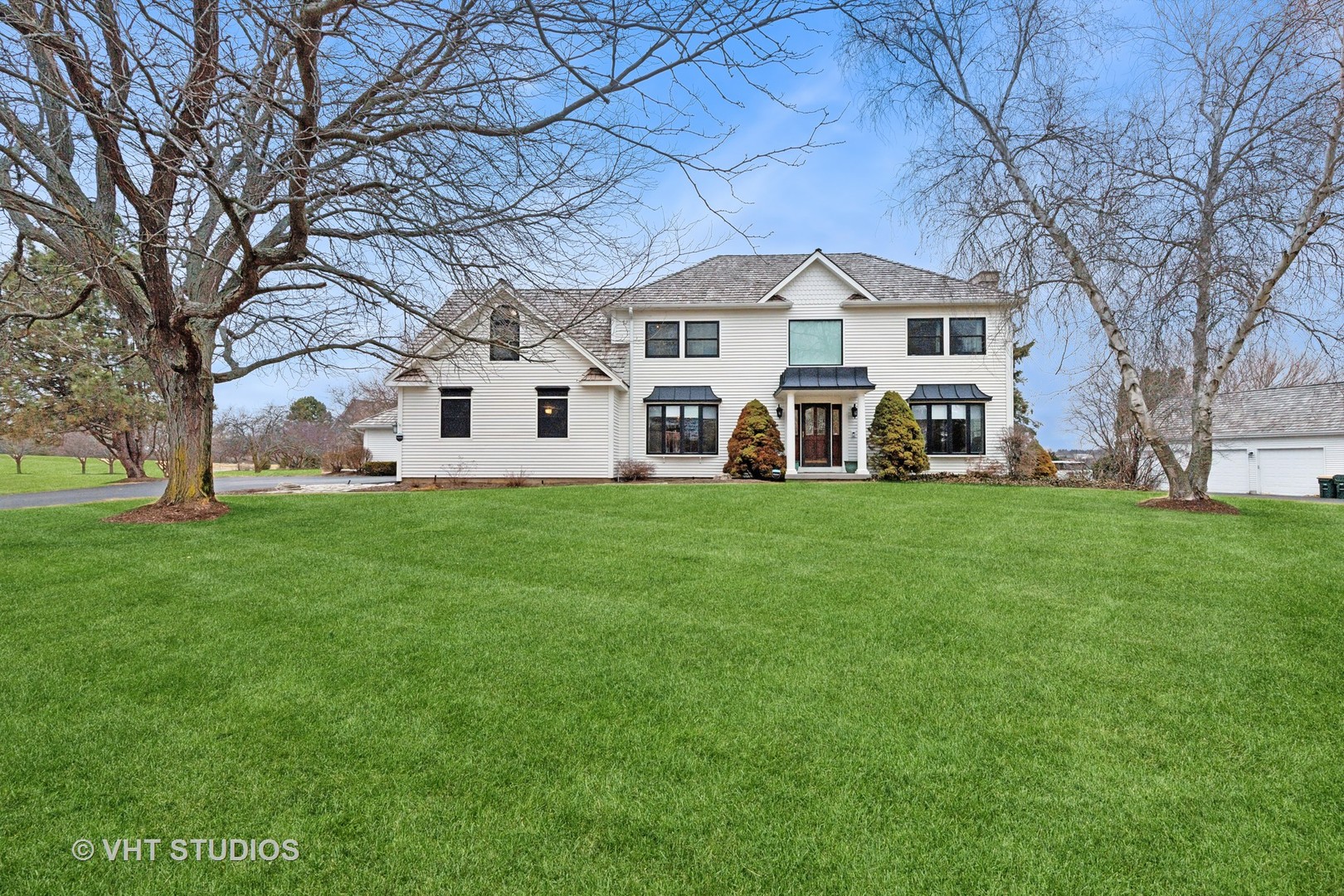1460 Eagle Ridge Drive Antioch, IL 60002 - Photo 2 of 47 a front view of house with yard and green space
