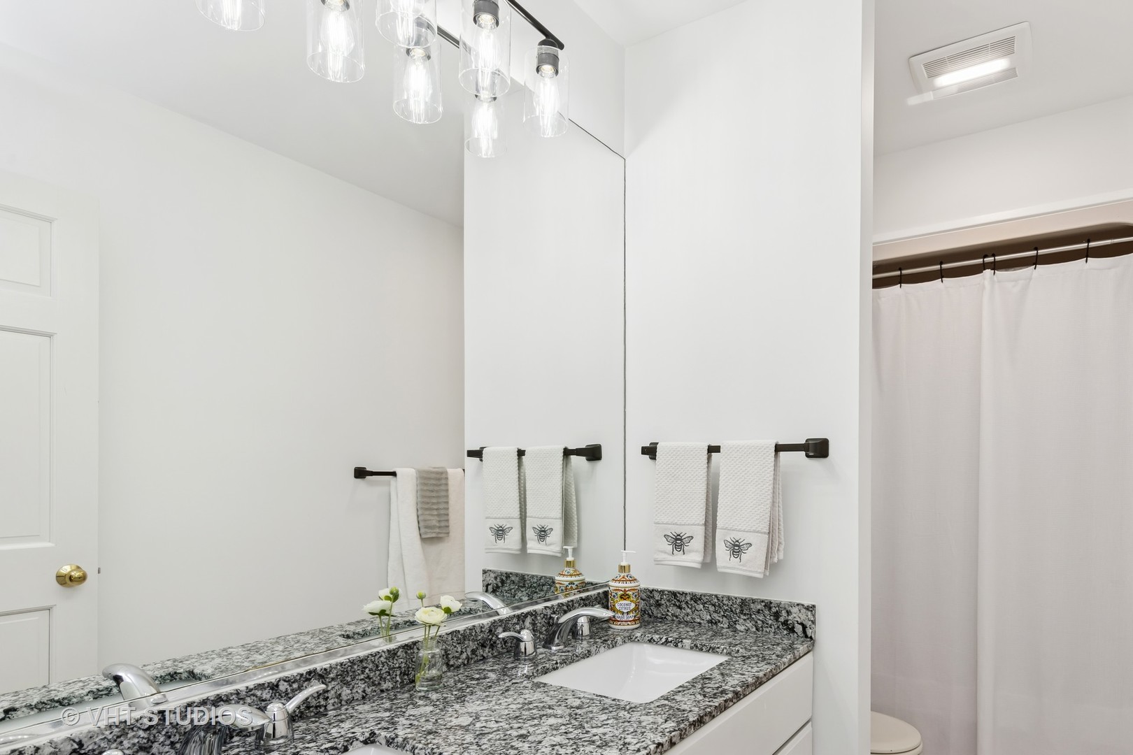 1460 Eagle Ridge Drive Antioch, IL 60002 - Photo 32 of 47 a bathroom with a granite countertop sink and a mirror